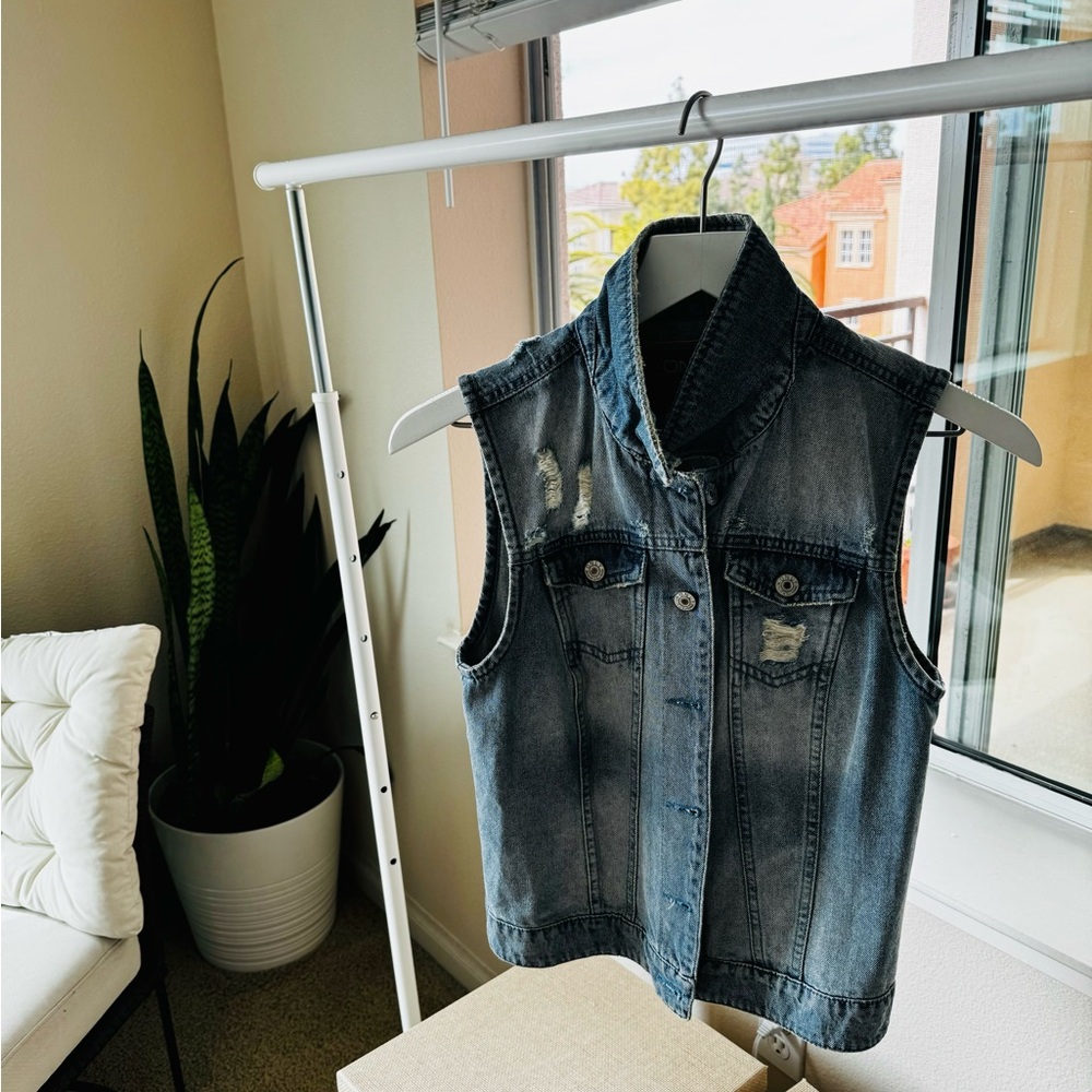 Inky blue denim jacket in a pristine new condition